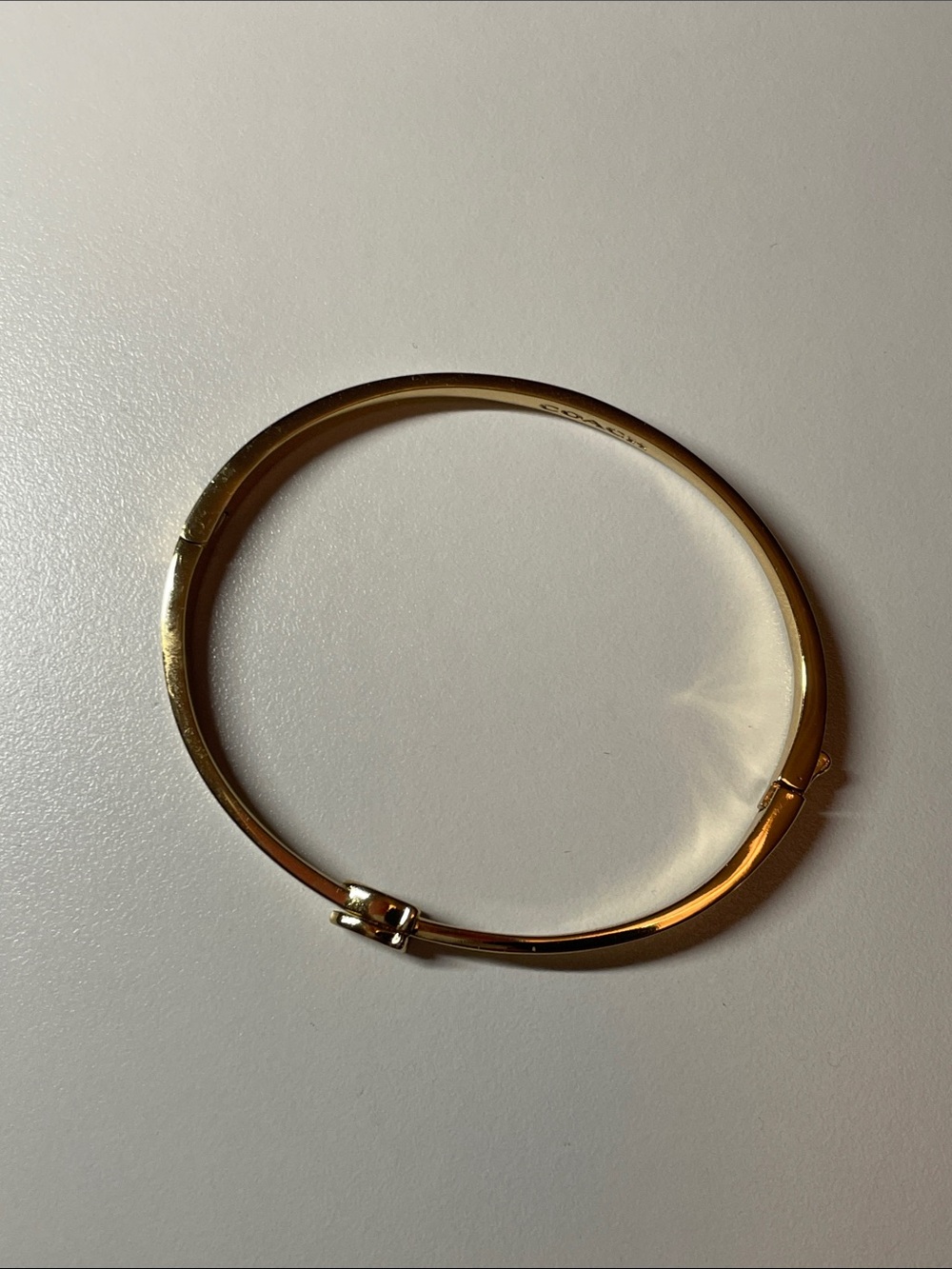 Coach Gold Tone Hinged Bangle Bracelet